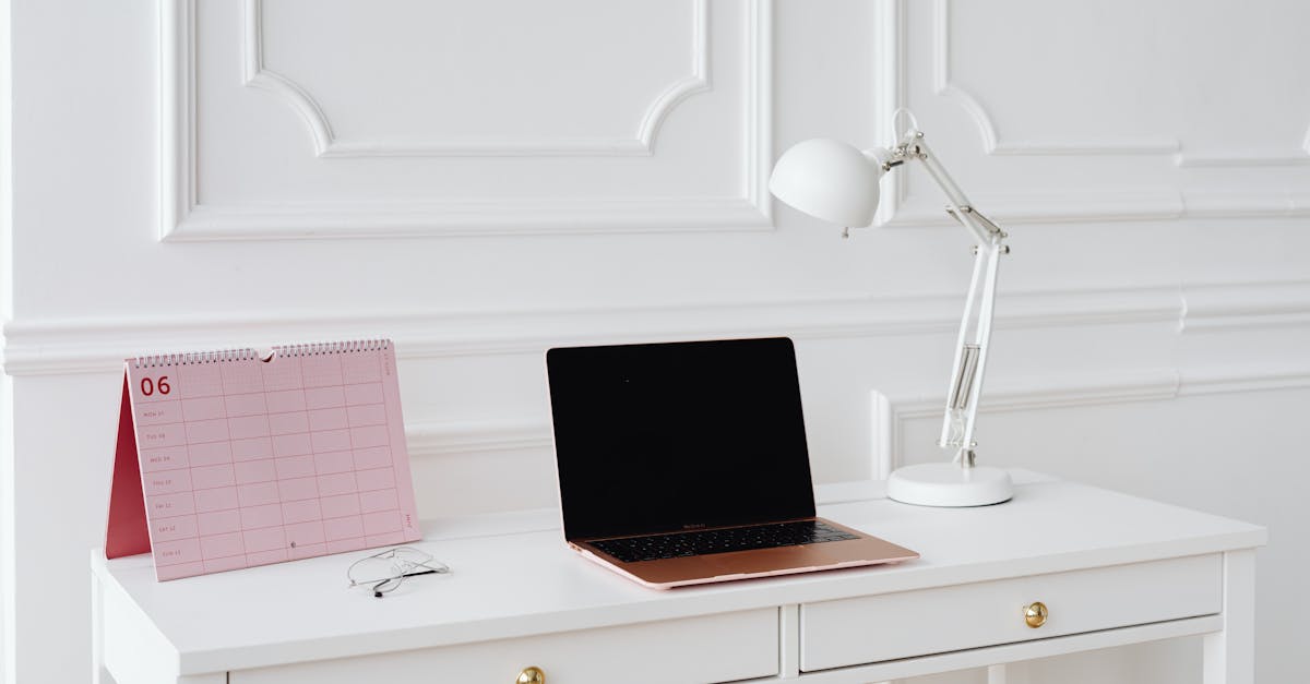 A laptop and calendar for managing an online tutors platform while traveling.